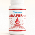 Flacon du complément alimentaire INDOKA ADAFER Plus présenté sur un fond neutre, avec un design minimaliste mettant en valeur l’étiquette rouge et blanche indiquant 300 mg, 60 gélules et les bénéfices en fer, vitamine C, acide folique et microbiotes.